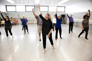 Aerobic exercises, which work to increase the heart rate, are incorporated into class and can help slow down the progression of Parkinson’s symptoms. © Chris Hardy