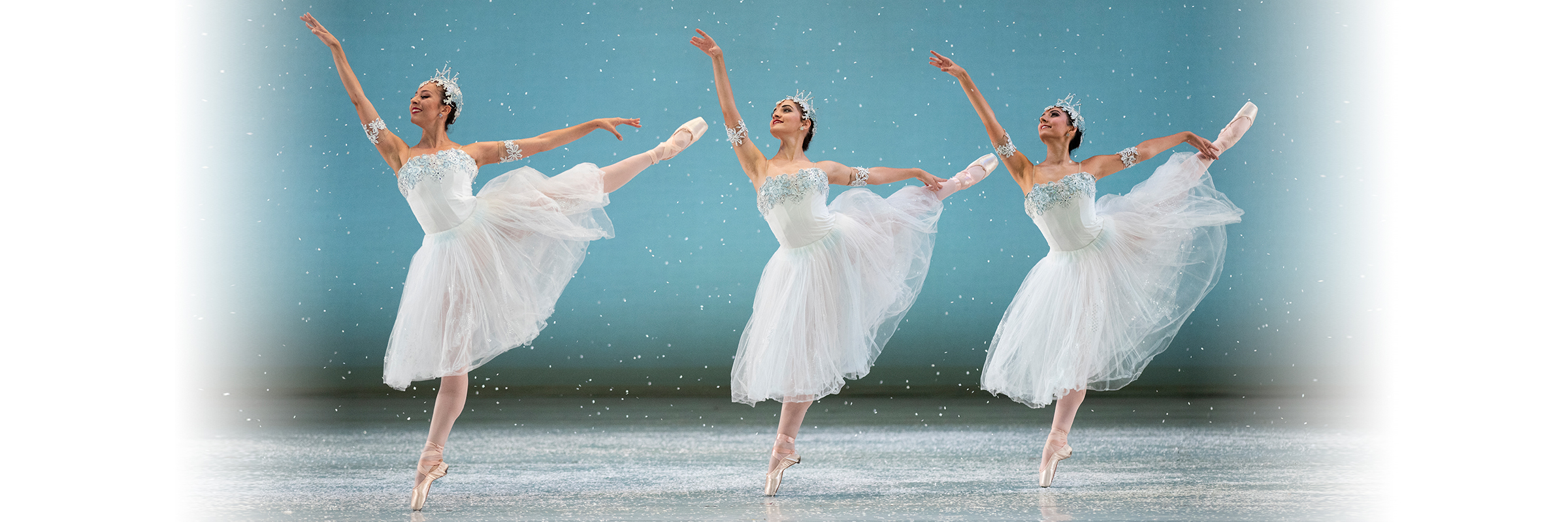 Snow gently falls as three Snowflakes move right, balancing on right legs, left legs raised behind, right arms up, left arms back