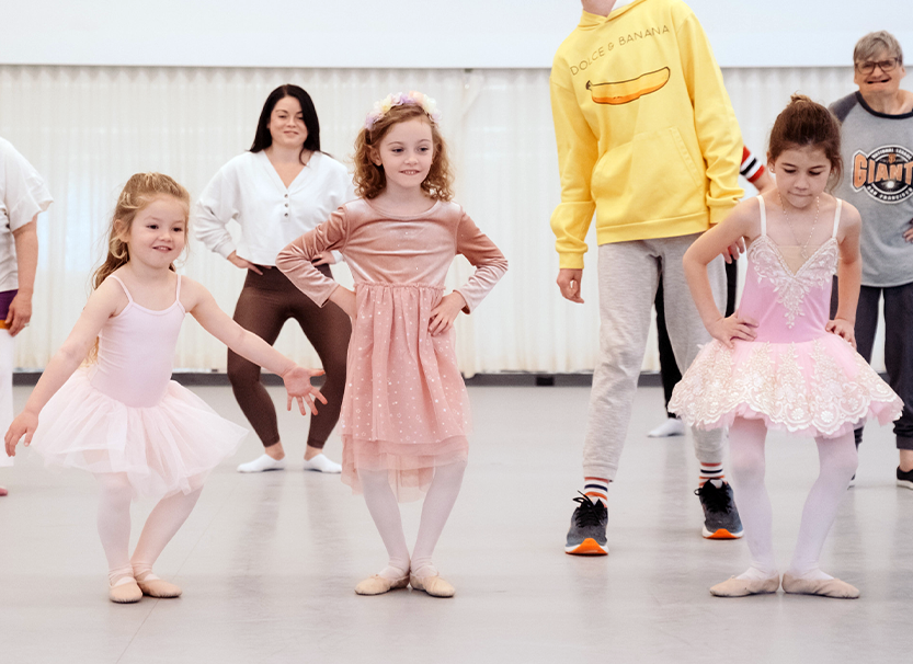 Three young girls dancing during a SF Ballet Dance Along