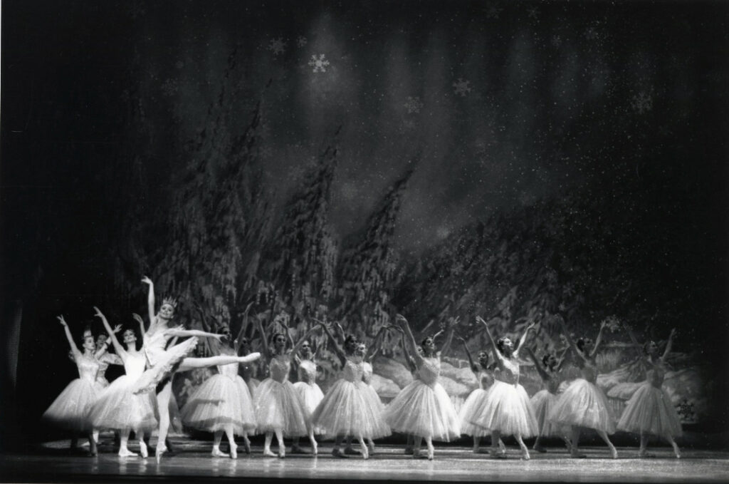 "Land of the Snow" scene featuring a dancer as Queen of the Snow and other dancers as Snowflakes in Lew Christensen's "<em>Nutcracker</em>" 