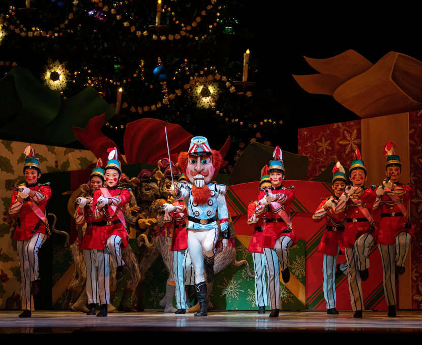 Toy soldiers march in a line with the Nutcracker